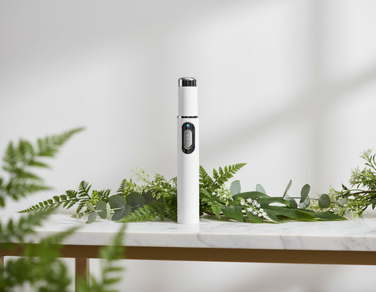 White electronic device with a blue light on a white background