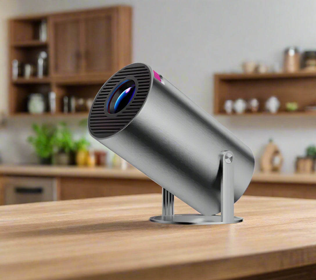 Silver cylindrical projector on a white background