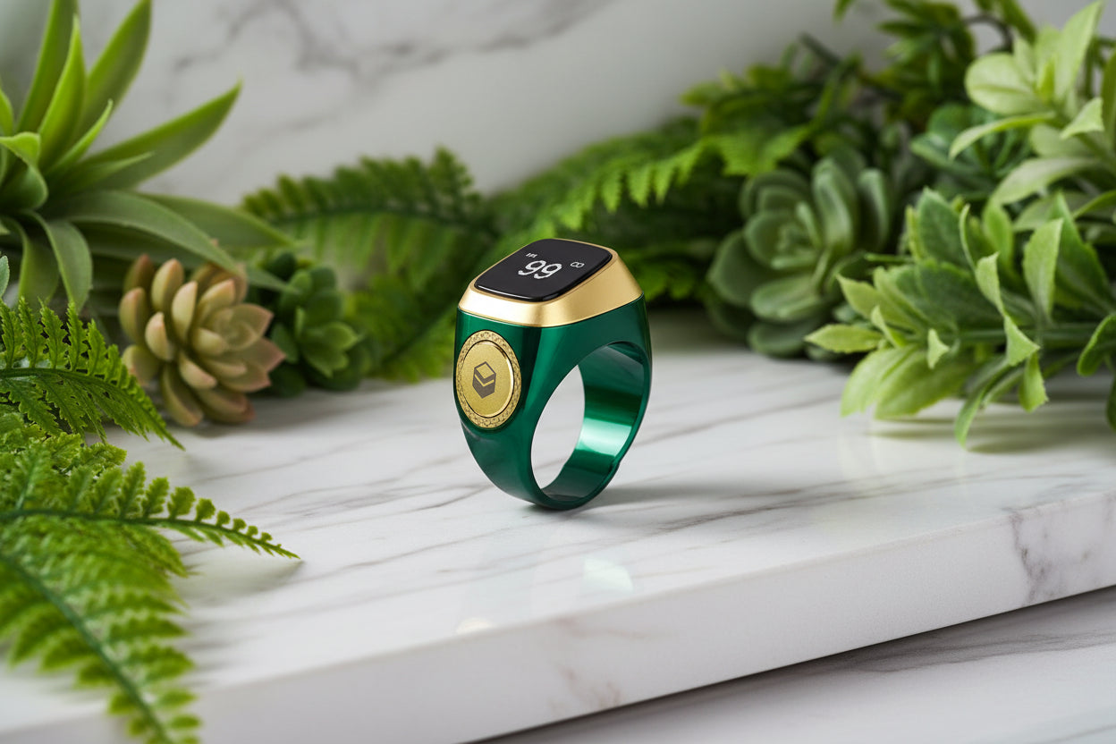 Green and gold smart ring with digital display on a white background