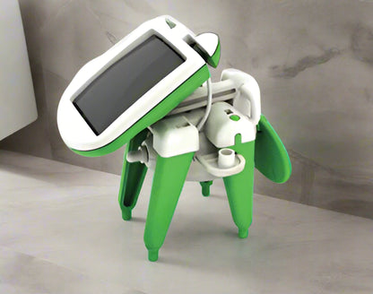 Green and white robot toy with solar panel on a white background