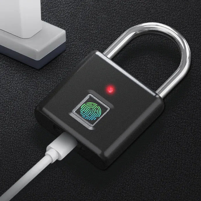Fingerprint lock with USB cable on a dark surface