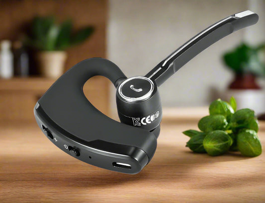 Black Bluetooth headset on a white background