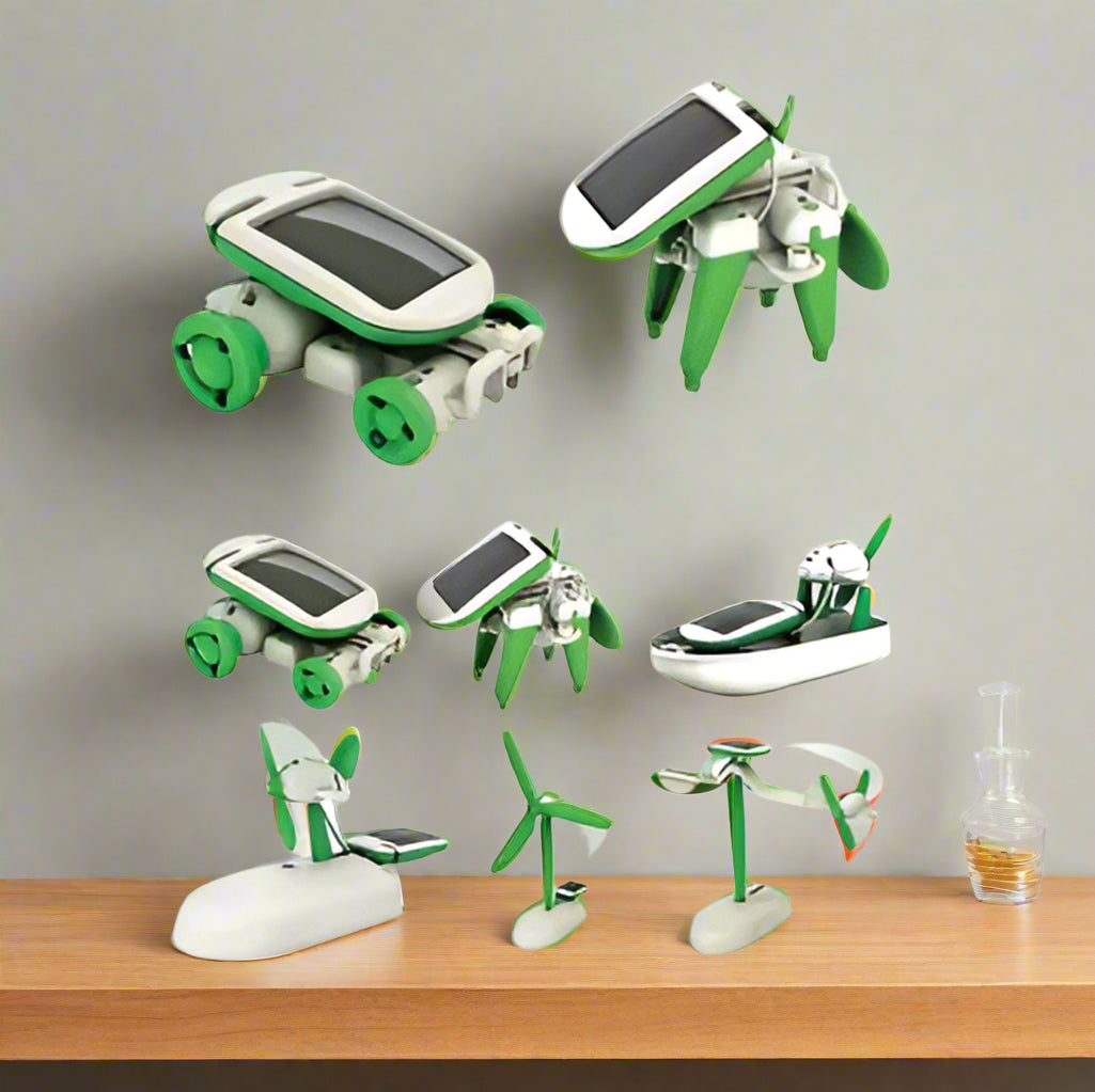 Set of green and white solar-powered toy vehicles on a white background