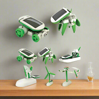 Set of green and white solar-powered toy vehicles on a white background