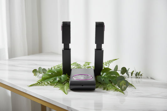 Black electronic device with two handheld components on a white background