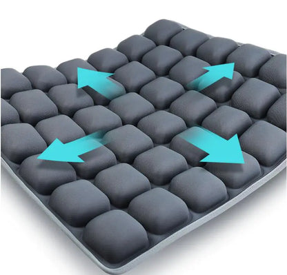 Gray cushion with blue arrows indicating pressure points on a white background