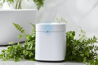 White cylindrical auto trach can device on a light gray surface with text describing features.