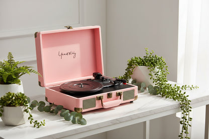 Pink vintage-style record player with 'Yeastay' branding on a white background