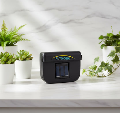 Black 'Auto Cool' device with solar panels on a white background