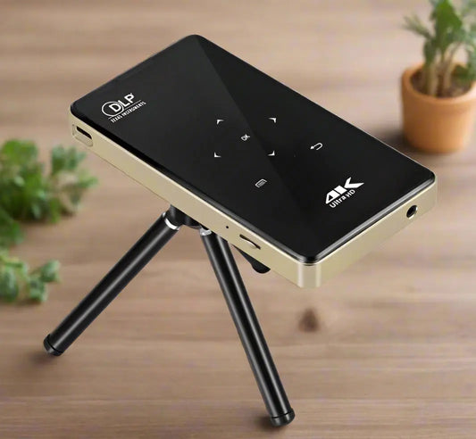 Black and gold electronic device with a tripod stand on a white background