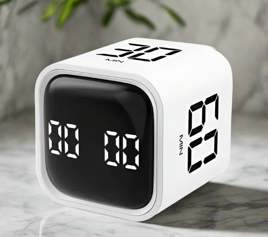 Digital clock with LED display on a white background