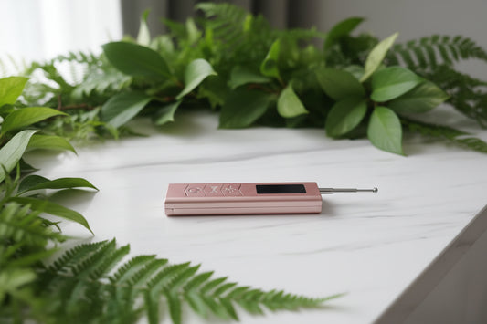 Rose gold electronic device with a screen on a light gray background