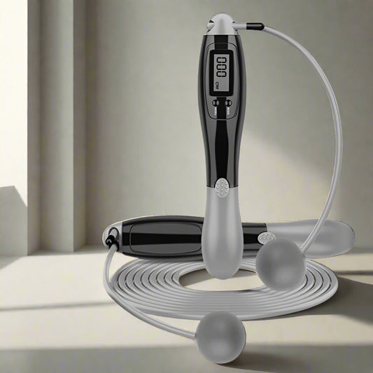 Digital jump rope with a black handle and gray jump ropes on a white background