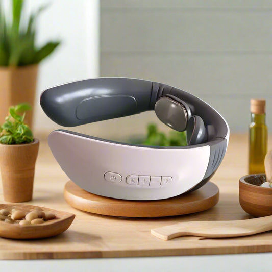 Neck and shoulder massager on a light green surface