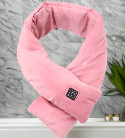 Pink neck pillow heater with heating element on a white background