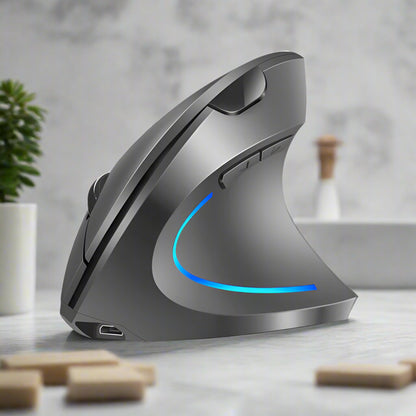 Gray ergonomic mouse with blue light on a white background