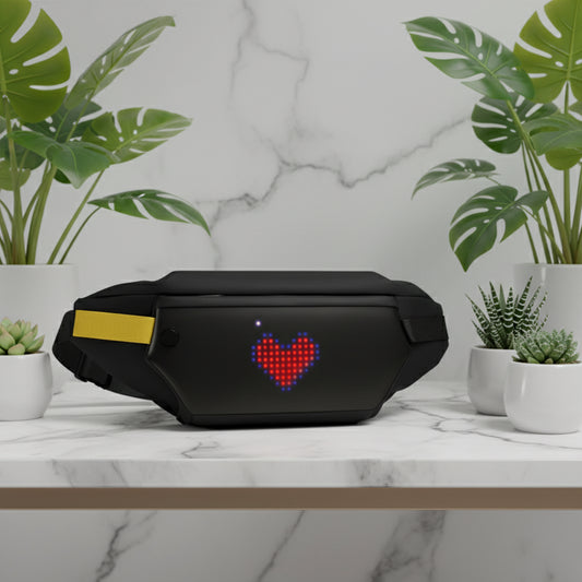 Black electronic device with a heart-shaped LED display on a white background